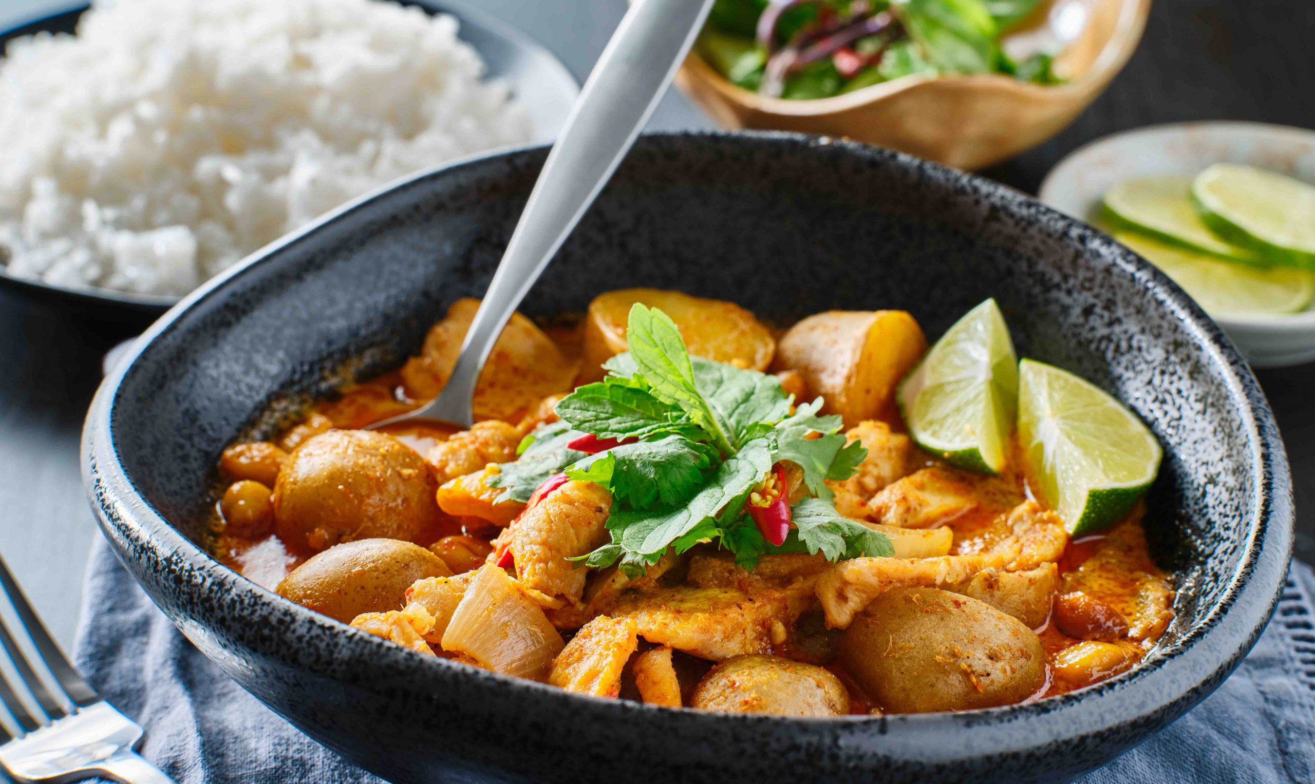 thai massaman curry with chicken and potatoes in bowl